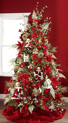 a christmas tree decorated with red and white decorations