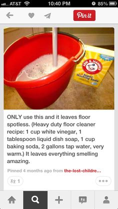 a red bucket filled with white stuff sitting on top of a counter