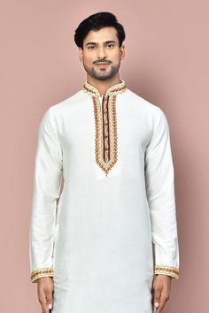 White full sleeve straight kurta with placement hand zardozi embroidery. Paired with a maroon dhoti pant.
Components: 2
Pattern: Placement Embroidery
Type Of Work: Zardozi
Neckline: Stand Collar
Sleeve Type: Full Sleeves
Fabric: Cotton
Color: White
Other Details: 
Embroidered cuffs on kurta
Occasion: Sangeet - Aza Fashions White Long Sleeve Churidar For Puja, Traditional White Kurta With Dabka, Embroidered Traditional Sherwani For Puja, Ceremonial Sherwani With Embroidered Border For Festivals, White Raw Silk Kurta For Navratri, Traditional White Nehru Jacket With Dabka, Traditional Long Sleeve Nehru Jacket For Diwali, Traditional Ceremonial Churidar With Embroidered Border, Festive Nehru Jacket With Embroidered Border For Eid