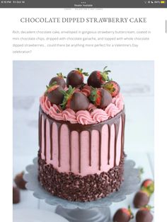 there is a cake with chocolate and strawberries on the top that has pink icing