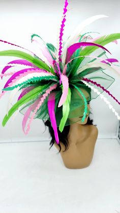 Extral Large multi-colored Green Fascinator. This is a show stopper!@ Beautiful headpiece for bridesmaids and a great accessory for a cocktail party or church outfit.  Comes with a pin or headband for an elegant but secure look. You may CHOOSE YOUR OWN COLORS - Headband  - Ready to ship  - Lightweight - Free Shipping - Fast shipping - Customize by adding different color flowers and or feathers Check my store for styles and colors.  Hatsandpearls.etsy.com Find more at my website: Www.hatsandpearls.com  Reach out to me if you can't find what you are looking for.  I can make cake custom orders and help you style and match your outfit  Tag and share your pictures when you wear and style our hats.  Instagram: @hats_pearls Facebook: Hats Pearls Thank you for visiting and happy shopping! Luxury Green Hat Band For Kentucky Derby, Multicolor Feather Fascinator For Kentucky Derby, Multicolor Feathered Fascinator For Kentucky Derby, Multicolor Carnival Headband Fascinator, Whimsical Multicolor Headpieces For Spring, Whimsical Multicolor Costume Hats And Headpieces For Spring, Multicolor Kentucky Derby Headpiece, Multicolor Costume Hats For Royal Ascot Races, Spring Multicolor Adjustable Costume Hats And Headpieces