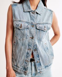 Elevate your wardrobe with the Abercrombie & Fitch Women's Denim Trucker Vest, a perfect blend of classic style and modern flair. This light wash vest is designed to enhance any outfit with its timeless trucker details and versatile functionality.

- Size: XS
- Color: Light Wash
- Material: Cotton, Lyocell
- Gender: Female
- Age Group: Adult

Crafted for comfort and style, this vest features side entry pockets for practicality and is made from a durable blend of cotton and lyocell, ensuring a so Trendy Denim, Outfit Making, Women's Coats & Jackets, Denim Fabric, Casual Wardrobe, Womens Vest, Color Light, Denim Women, Abercrombie Fitch