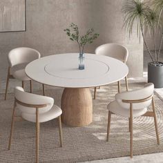 a white table with four chairs around it