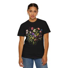 Wildflower Vintage Boho Floral Tee Embrace natural beauty and effortless charm with our Wildflower Vintage Boho Floral Tee. This exquisite wildflower graphic tee is the perfect fusion of vintage aesthetics and modern bohemian style, making it an ideal feminine gift for her. Crafted from soft, breathable, and high-quality 100% organic cotton, this tee not only looks beautiful but feels incredible against the skin. The intricate wildflower design is meticulously screen-printed using eco-friendly inks, ensuring both durability and a vibrant finish that stands the test of time. Available in sizes ranging from XS to XXL, our floral tee offers a comfortable, flattering fit for all body types. Whether you're styling it with your favorite pair of jeans for a casual day out or layering it under a c Mother's Day Floral Print Crew Neck T-shirt, Multicolor Tops For Spring As A Gift, Floral Print Graphic Tee As Gift, Graphic Tee With Floral Print As A Gift, Floral Print Graphic Tee As A Gift, Crew Neck Floral Print T-shirt For Mother's Day, Floral Print Crew Neck T-shirt For Mother's Day, Floral Print Short Sleeve Top As Gift, Floral Print Summer Tops As A Gift