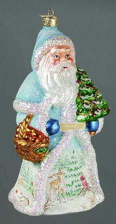 a glass ornament with a santa holding a christmas tree