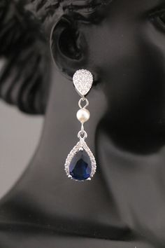 "Navy Blue Sapphire Blue Bridesmaid Earrings, Dark Blue Earrings, Bridesmaid Gift, Navy Wedding, Bridesmaid Jewelry, Bridal Jewelry This vintage inspired stunning Pearl and Cubic Zirconia earring is beautiful addition to your wedding day. Earrings size Measures: 1.75\" x 0.5 \" nickel-free post backing. Tone color: - Sliver tone Pearl color : -- Swarovski white pearl -- Swarovski ivory pearl -- Fresh water pearl Crystal Color : - # 1 Champagne Color - # 2 Crystal Rainbow Dark Blue Color - # 3 Bl Wedding Day Earrings, Blue Wedding Earrings, Wedding Earrings Pearl, Blue Earrings Wedding, Blue Wedding Hair, Blue Bridal Earrings, Dark Blue Earrings, Bridesmaid Pearl Earrings, Boho Items