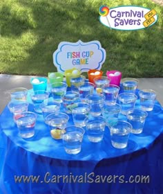 there is a table with cups on it and a sign that says carnival savers