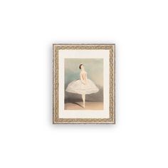 a painting hanging on the wall with a ballerina in white dress and gold frame