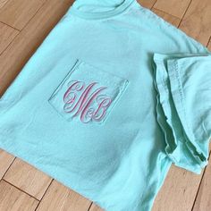 Casual Cotton Monogram T-shirt, Green Short Sleeve T-shirt With Side Pockets, Green Cotton T-shirt With Side Pockets, Blue Monogram Cotton Tops, Short Sleeve Cotton Monogram Top, Short Sleeve Cotton Tops With Monogram, Short Sleeve Cotton Top With Monogram, Monogrammed Short Sleeve Cotton T-shirt, Monogram Pocket Tees