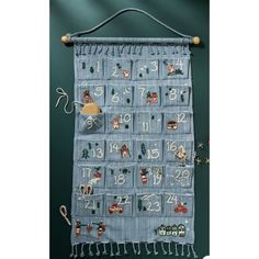 a blue christmas calendar hanging on a wall