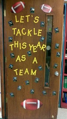 a door decorated with footballs and the words let's tackle this year as a team