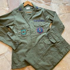 This US Air Force Medical Officer OG 507 107 Utility Fatigue Shirt Pant Belt Patches set is a must-have for any militaria collector. The outfit is made by Coastal Enterprises and is completely original, perfect for those looking for authentic pieces. The set includes a shirt, pant, belt, and patches from Malcom Crow Medical Center, all in excellent condition and ready to be added to your collection. The OG 507 color scheme adds to the authenticity of this uniform. Ideal for display or collecting Us Air Force Uniform, Air Force Uniforms, Shirt Pant, Us Air Force, Medical Center, Color Scheme, Air Force, Must Haves, Medical