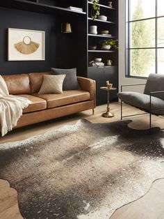 a living room filled with furniture and a rug