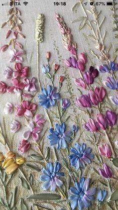 some very pretty flowers on a table cloth