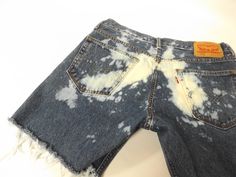 vintage 90s levi cut off blue jean shorts. distressing throughout with raw frayed bottom hem. W 33 on the tags but waist is a comfortable 34 inch waist, see measurements. LABEL || levi strauss and co. MATERIAL || cotton denim CONDITION || great distressed || ready to wear MEASUREMENTS || in inches size || W 33 on tags outside length waist to bottom || 15 1/2 inseam length || 6 rise || 10 waist lying flat doubled || 34 hips lying flat/doubled || 44 ~~see more shorts here www.etsy.com/shop/roadkil Spring Grunge Cutoff Jean Shorts, Festival Cutoff Jean Shorts With Frayed Hem, Acid Wash Shorts For Summer Streetwear, Distressed Cotton Festival Shorts, Distressed Cotton Shorts For Festival, Summer Acid Wash Shorts For Streetwear, Summer Streetwear Acid Wash Shorts, Faded Jean Shorts For Summer Streetwear, Grunge Cutoff Jean Shorts For Summer