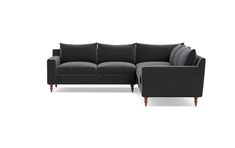 a black couch and chair sitting next to each other on a white background with no one in it