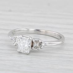 an engagement ring with three stones on it