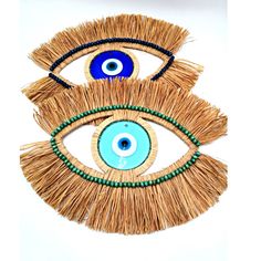 Evil Eye Raffia Wall Hanging, Artisan-Crafted Raphia Decor, Spiritual Charm for Home Protection, Unique Birthday Gift Dimensions: Full dimensions: 50 cm * 38 cm (19 * 15 inches)  Diameter of the evil eye: 12 cm (4,7 inches)  * Slight variations in colors and sizes may occur depending on the condition of the material. * Be aware that colors can vary depending on the display screen and lighting (natural vs. low light). To see more of these beautiful works, please visit the Authentic Anatolian Arts Diy Multicolor Handmade Crafts, Bohemian Handmade Craft Supplies For Gifts, Diy Handmade Multicolor Crafts, Handmade Green Craft Supplies For Gifts, Blue Handmade Crafts For Gifts, Handmade Blue Crafts For Crafting, Evil Eye Diy Wall Hangings, Evil Eye Textured Art, Evil Eye Hanging Diy