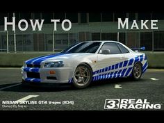 a white and blue car driving down a street next to a tall building with the words how to make nissan skyline gtr v - r34