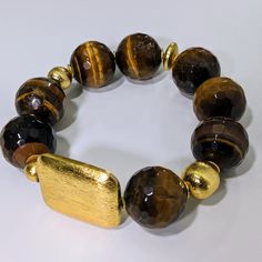 Ro & Gieo Black Multifaceted Agate & 24 Karat Goldplated Brass Bracelet Bead size - 19 mm 7 inches bracelet 7 inches bracelet length If you want your bracelets in a different size than 7 inches, we are more than happy to accommodate your request. Please simply specify your BRACELET WRIST SIZE IN INCHES into the ORDER SPECIAL INSTRUCTIONS section in cart checkout page. One size fit most - slightly elastic Slip-on style Perfect for everyday wear or dress up Wear alone or as a set or stacked with o Black Agate Stone, Bracelet Wrist, Bracelet Bead, Cuff Bangle Bracelet, Brass Bracelet, Agate Bracelet, Black Agate, Cuff Bangles, Agate Beads