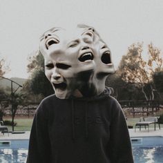 a person with two masks on their head near a pool