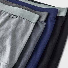 Stay relaxed and comfortable all day and all night with this 5-Pack Classic Trunks from Goodfellow & Co™. Designed in a comfort fit with added support and featuring a tagless design, these boxer briefs are made from a soft and stretchy fabric for all-day and all-night comfort. This pack includes four pairs in solid gray, charcoal gray, black and blue hues to add variety to your underwear drawer. Goodfellow & Co™: Where style & fit are always in good company. Casual Stretch Boxer Briefs With Comfort Waistband, Casual Cotton Boxer Briefs For Everyday, Casual Everyday Cotton Boxer Briefs, Casual Black Go-dry Boxer Briefs, Solid Color Multi-pack Boxer Briefs For Loungewear, Cotton Sports Bottoms With Soft Touch, Casual Solid Color Boxer Briefs For Loungewear, Casual Solid Boxer Briefs With Comfort Waistband, Gray Stretch Boxer Briefs For Loungewear