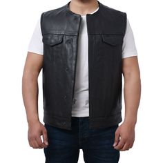 This vest is high-end in just about every way: Logan comes with mesh lining, easy access panels for patches and embroideries, and cropped center zipper. The result is just about all you can ask for in a vest, from weight and warmth to functionality and looks. Features: 1-1.2mm Drum Dye Naked Cowhide 2 buttoned chest pockets 2 buttoned slash pockets Club style with roll-up collar and covered snaps Easy access concealed carry pocket on the left side Interior concealed carry on right hand side Inte Fitted Leather Biker Vest, Sleeveless Leather Vest For Bikers, Rugged Leather Sleeveless Vest, Mens Leather Vest Motorcycle Black, Leather Sleeveless Vest For Motorcycling, Motorcycle Leather Vest, Access Panels, Motorcycle Leather, Club Style