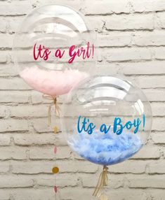 it's a boy and its a boy bubble balloons with tassels hanging from them