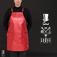 a woman standing in front of a black background wearing an apron and hat with the words fancy gents on it