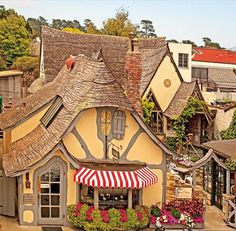 an image of a small house that looks like it is in the middle of town