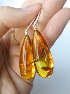 Dark cognac color natural amber drops earrings medium size Elegant Amber Teardrop Earrings, Elegant Amber Dangle Earrings, Elegant Brown Teardrop Earrings For Gift, Classic Amber Earrings For Formal Occasions, Elegant Amber Earrings For Formal Occasions, Amber Teardrop Earrings, Elegant Handmade Amber Earrings, Elegant Baltic Amber Teardrop Jewelry, Handmade Orange Earrings For Formal Occasions