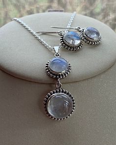 "Round Moonstone moons pendant with two stone gemstone necklace encased in sterling silver 925 bezel setting in an elegant beaded border for women  Natural top grade aaa gemstone jewelry and a crystal of love and heart, new beginnings in a dainty design.  Perfect gift for wedding jewelry bridal shower, Anniversary, Birthday, or any special occasion. Matching earrings drops can be found in our earrings section. Dimensions: Pendant - 50 mm from the chain  Gemstone- 17 mm and 15 mm in diameter. hallmark 925 The necklace comes with a delicate and elegant sterling silver chain, secured with a spring clasp at the back  The length of the chain can be selected from the options above. Healing- A Gemstone for \"New beginnings\", and 'Love', Moonstone is a stone of inner growth and strength. It sooth White Pendant Jewelry With Bezel Setting, White Sterling Silver Moon Phase Jewelry, Moonstone Round Pendant Jewelry For Anniversary, White Round Pendant Jewelry With Bezel Setting, Sterling Silver Dangle Earrings With Bezel Setting, Sterling Silver Jewelry With Bezel Setting And Dangle Shape, Sterling Silver Jewelry With Bezel Setting, Silver Pendant Jewelry With Bezel Setting, Sterling Silver Jewelry With Bezel Setting In Round Pendant