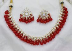 Red Beads Necklace Earrings Set/ Kundan Sleek Necklace Earrings Set, Designer Bridal Necklace Earrings, Indian Wedding Jewelry Set Kundan Necklace/Kundan Earrings/Beads Jewelry/Beads Necklace For the classy women out there 😍😍 ITEM DESCRIPTION Metal = Gold Plated Occasion = Wedding, Party Wear, Bridal Color = Hot Pink and Gold Necklace Size = 16 CM Earring Size = 3 CM Designer Latest Kundan Necklace Earrings Set Free Shipping Red Beads Necklace, Indian Wedding Jewelry Sets, Earrings Beads, Red Beaded Necklaces, Wedding Jewelry Set, Party Mode, Earrings Indian, Kundan Necklace, Red Beads