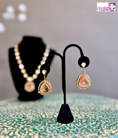 Enhance your ensemble with our Peach Stone and Kundan Necklace Set - a luxurious accessory fit for any occasion! Crafted with top-notch materials, it brings a touch of sophistication to your appearance. Its impeccable design ensures a secure and comfortable fit. Elevate your fashion game with our Peach Stone and Kundan Necklace Set now. Elegant Necklaces With Matching Earrings For Party, Teardrop Necklace With Matching Earrings For Parties, Elegant Evening Jewelry With Detachable Pendant, Party Teardrop Necklace With Matching Earrings, Formal Rose Gold Jewelry With Detachable Pendant, Elegant Wedding Jewelry Sets With Detachable Pendant, Elegant Gold Jewelry Sets With Detachable Pendant, Elegant Jewelry Sets With Detachable Pendant, Elegant Necklace With Detachable Pendant For Party