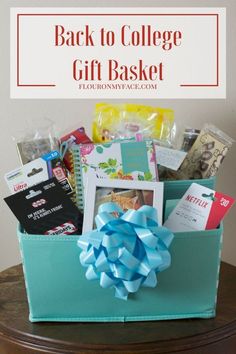 the back to college gift basket is sitting on top of a table with blue ribbon