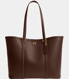 From COACH&#x2C; the Legacy Pebbled Leather Tote Bag features: A classic wardrobe staple&#x2C; this polished pebbled leather tote by COACH is always in style. LeatherSnap closureBrass-tone hardware & logo; interior zip pocketSpot cleanApprox. 11"W x 11"H x 5-.5"D (width is measured across the bottom of handbag); 1.65 lbs. approx. weightApprox. 10" L handlesImported. Coach Monogram, Coach Leather Bag, Coach Legacy, Hardware Logo, Classic Wardrobe Staples, Monogram Tote, Zip Tote, Classic Wardrobe, Coach Leather