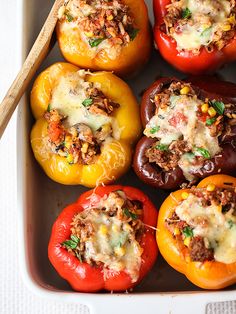 stuffed bell peppers with meat and cheese on top are ready to be cooked in the oven