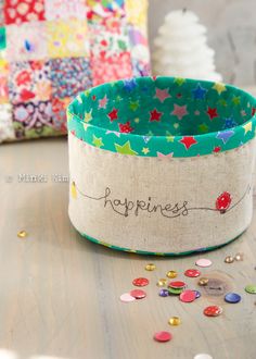 a close up of a cup on a table with confetti