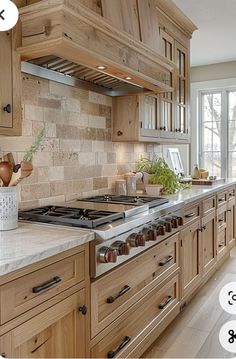 a kitchen with wooden cabinets and white marble counter tops is featured in this postcard