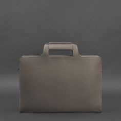 An original bag for a laptop and documents will emphasize the status and style of the owner.The bag is made of high-quality genuine leather. Strong textile lining inside. All seams are sewn by hand with strong threads.The bag has one large compartment and a pocket for a laptop with a strap to fix the device. There are also two internal pockets for small items.It is convenient to carry the accessory in the hand or on the shoulder. A long leather shoulder strap is included.Such a bag will be a gre Modern Rectangular Briefcase For Daily Use, Minimalist Leather Briefcase For Work, Minimalist Leather Satchel With Top Carry Handle, Modern Rectangular Leather Backpack For Work, Top Handle Bags With Laptop Sleeve, Office Top Handle Bags With Laptop Sleeve, Business Briefcase With Top Handle And Leather Handles, Leather Laptop Bag With Top Handle And Luggage Sleeve, Leather Laptop Bag With Luggage Sleeve And Top Handle