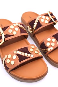 These sandals are the perfect combination of cool and casual. The double-strap design provides a classic look, while the studded detailing adds a touch of edginess. Easy to slide on, these sandals will make a statement wherever you go. Casual Sandals With Gold Studs For Summer, Casual Gold-studded Sandals For Summer, Open Toe Sandals With Rivets For The Beach, Trendy Gold-studded Open Toe Sandals, Trendy Studded Open Toe Sandals, Trendy Open Toe Sandals With Studs, Wedge Winter Boots, Sneakers And Socks, Free People Style