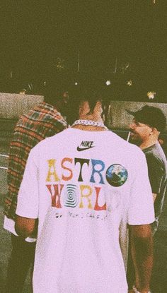 the back of a man wearing a white shirt with astro world on it's chest