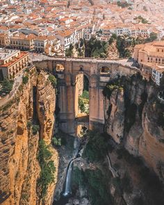 an aerial view of a bridge over a canyon