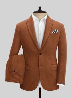 Venture into a stylish era by pulling out Naples Cosmic Tan Tweed Suit, which adds a modern touch to the vintage aesthetics. Further, our suit is cut from a pure wool fabric that showcases a smooth, supple and offers an incredibly sharp drape when worn. Nonetheless, the cloth is cut with expert tailoring, which lets yo Brown Linen Suits For Business Casual, Elegant Orange Blazer With Notch Lapel, Elegant Single Breasted Orange Blazer, Brown Linen Business Suits, Elegant Orange Notch Lapel Suits, Tailored Brown Linen Blazer, Elegant Tailored Orange Suit, Elegant Tailored Orange Blazer, Elegant Fitted Orange Suit