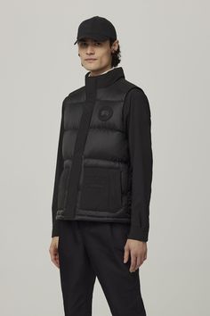 The Paradigm Freestyle Vest reimagines one of our most iconic silhouettes in two best-selling fabrics for a modern, mixed-media style. It has a down-filled collar and quilted body for warmth and style, wear it on its own or layered. Luxury Nylon Puffer Jacket, Designer Quilted Nylon Outerwear, Designer Quilted Nylon Puffer Jacket, Luxury Quilted Down Jacket With Padded Collar, Designer Nylon Puffer Jacket For Fall, Designer Fitted Puffer Jacket With Padded Collar, Fitted Designer Puffer Jacket With Padded Collar, Fitted Quilted Down Jacket With Padded Collar, Designer Nylon Puffer Jacket With Padded Collar