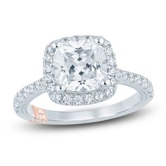 an engagement ring with a cushion cut diamond