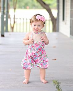 Searching for the perfect attire for your little one's first birthday celebration or a delightful photo session? Look no further! Our adorable and cozy romper is designed to highlight your baby's charm and cuteness. The romper's relaxed, billowy fit and elegant lace tie top not only adds a touch of whimsy but also ensures comfort, allowing for extended wear as your child grows. To maintain the romper's quality and softness, we suggest hand washing and air drying. Our model, which typically fits into size 24 months, showcases the larger size for 1-2-year-olds and still has ample room to move and play. This piece will surely become a cherished part of your little one's wardrobe! *Headband not included Cute Pink Bubble Romper For Birthday, Playful Sleeveless Bubble Romper For First Birthday, Cute Pink Bubble Romper For Cake Smash, Ruffled Bubble Romper For First Birthday In Summer, Playful Pink Bubble Romper For Cake Smash, Cute Pink Bubble Romper For First Birthday, Sleeveless Ruffled Bubble Romper For First Birthday, Pink Bubble Romper For First Birthday Summer, Summer Ruffled Bubble Romper For First Birthday