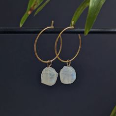 ✨ Golden, waterproof stainless steel hoop earrings with small, raw rainbow moonstones. ✨ Each moonstone is lovingly handcrafted into a pendant and finally a high-quality hoop earring. The size of the gemstones varies between 8-10 mm. Since these are natural stones, no two crystals are the same, each one is unique. ♥ The diameter of the hoop earrings is 2 cm. The hoop earrings are simply hooked together for easy opening and closing. 2 pieces per sale. ☼ To charge your crystal it can be placed in Adjustable Hoop Moon Charm Jewelry, Adjustable Moon Charm Hoop Earrings, Adjustable Hoop Earrings With Moon Charm, Round Moonstone Hoop Earrings As A Gift, Moonstone Hoop Earrings Gift, Moonstone Dangle Hoop Earrings As Gift, Huggie Hoop Earrings With Moon Charm For Gift, Moonstone Dangle Hoop Earrings For Gift, Nickel Free Moon Shaped Hoop Earrings Gift