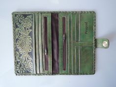 "GREEN PASSPORT WALLET, Tooled Leather Purse, Green Biker Wallet, Full Leather Lining, Vintage Style, Hand Painted Leather, Bifold Wallet. TRAVEL WALLET GREEN / Beautifully Hand Tooled Women's Wallet, Leather Clutch. Stunning Hand Tooled, Hand Crafted in Romantic Floral Swirls. Hand painted leather. Eco Friendly leather, vegetable tanned leather. No 2 pieces will ever be exactly alike. Our dedicated artisan hails from a large family of artists, so each piece is a memorable piece of art. Cotton D Green Leather Wallet With Card Slots, Green Leather Travel Wallet, Green Wallets With Interior Card Slots For Daily Use, Green Leather Wallets For Daily Use, Green Leather Bifold Wallet, Daily Use Green Leather Wallet, Vintage Green Wallets With Card Slots, Green Travel Wallets With Card Slots, Green Bifold Wallets With Interior Card Slots