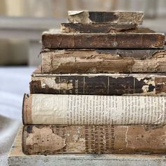 a stack of old books sitting on top of each other